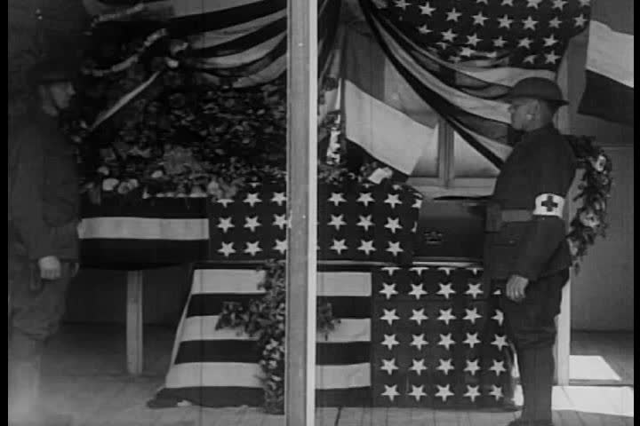 1910s - Eddie Rickenbacker and the 94th Aero Squadron honor the dead in World War One.