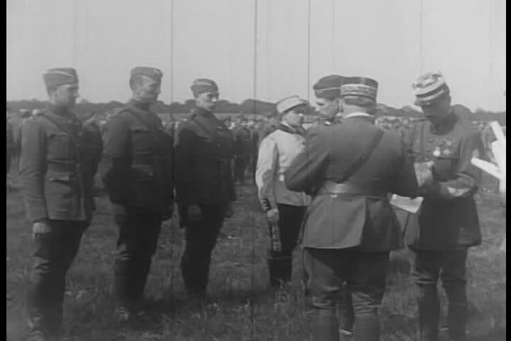 1910s - Eddie Rickenbacker and the 94th Aero Squadron receive medals for their service in World War One.