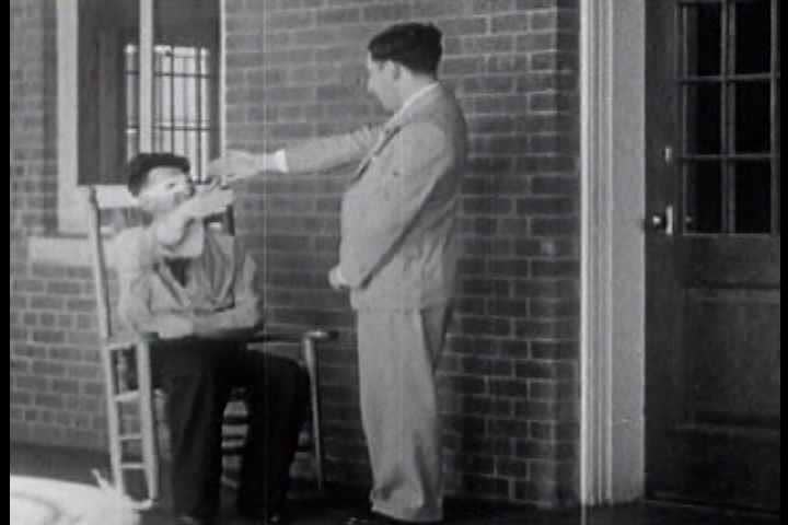 1940s - Silent footage from a lunatic asylum in the 1940s with patients displaying various forms of psychological disorders, particularly catatonic states.