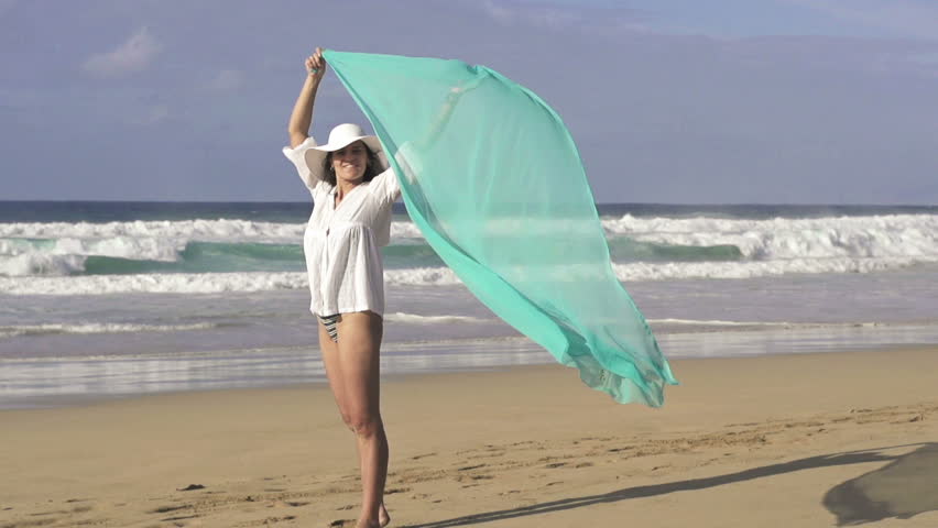 Sexy woman with pareo on beach, super slow motion, shot at 240fps
