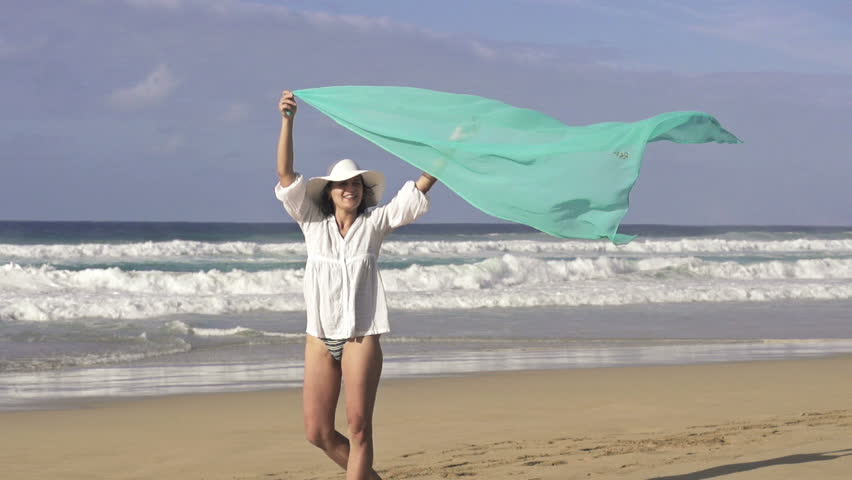 Sexy woman with pareo on beach, super slow motion, shot at 240fps
