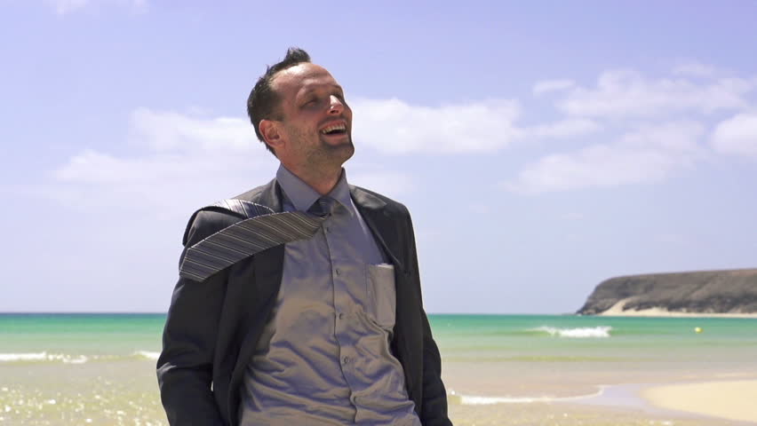 Happy businessman on the beach, super slow motion, shot at 240fps
