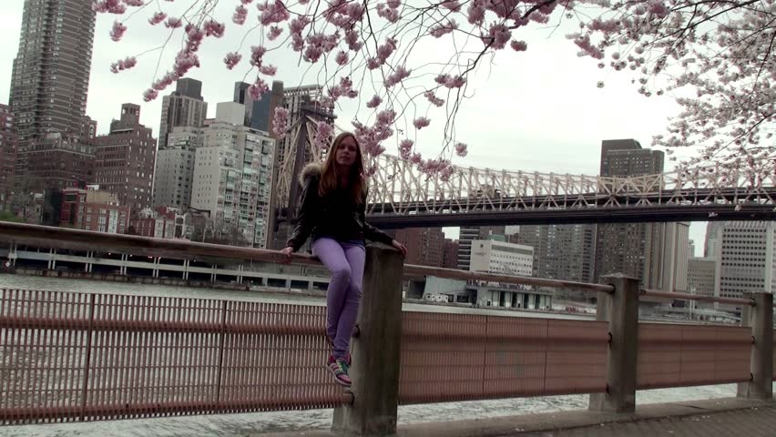 Girl's enjoying cherry blossoms at the Roosevelt Island.