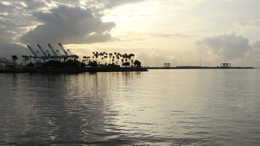 Los Angeles, CA - CIRCA May 2013: Container Ship Xin Hong Kong IMO: 9314222 departing the Port of Los Angeles at sunrise