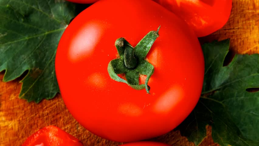 raw vegetables : some uncooked ripe fresh tomatoes over blue table on cutting board 1920x1080 intro motion slow hidef hd