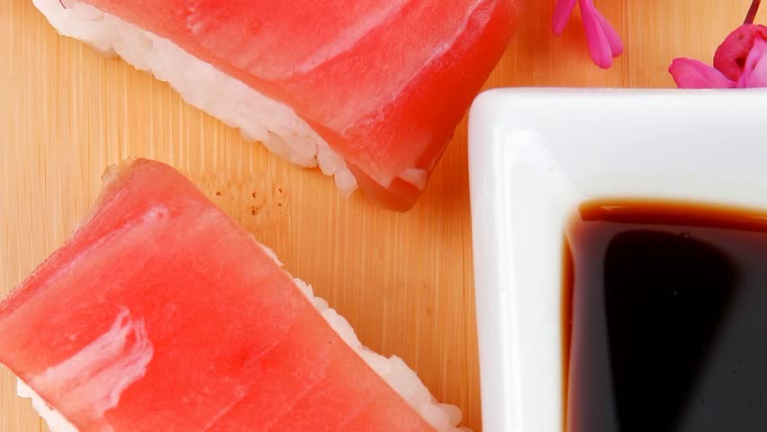 Nigiri Sushi - Set of Nigiri sushi topped with raw Tuna (maguro) . . on wooden board 1920x1080 intro motion slow hidef hd