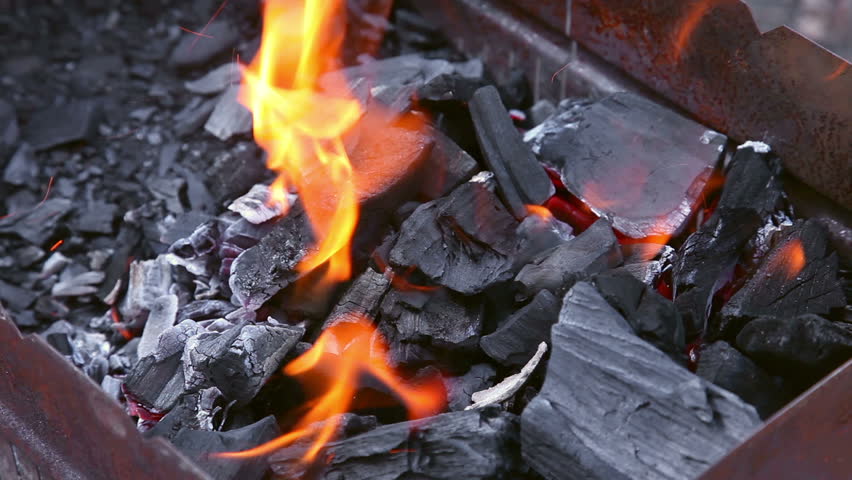 Coals burning in the brazier for barbecue. 
