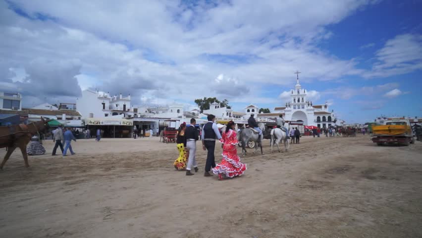 El ROCIO, ANDALUCIA, SPAIN - MAY 19: Pilgrims, people attend to the Sanctuario de Nuestra Senora de El Rocio in one of the most famous religious pilgrimage of Spain. May 19, 2013 in el Rocio, Spain