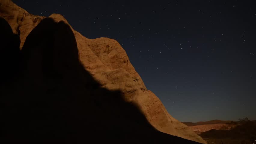 Astrophotography Time Lapse Moonshadow across Sandstone Tilt Up