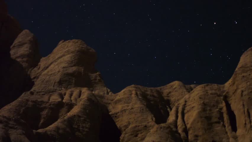 Astrophotography Time Lapse Moonshadow across Sandstone Zoom In