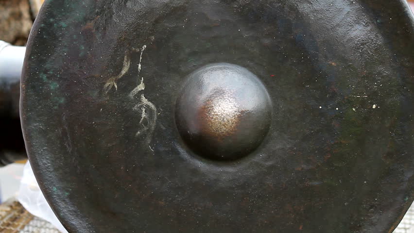 A man hit the gong with Thai northern Native bands.