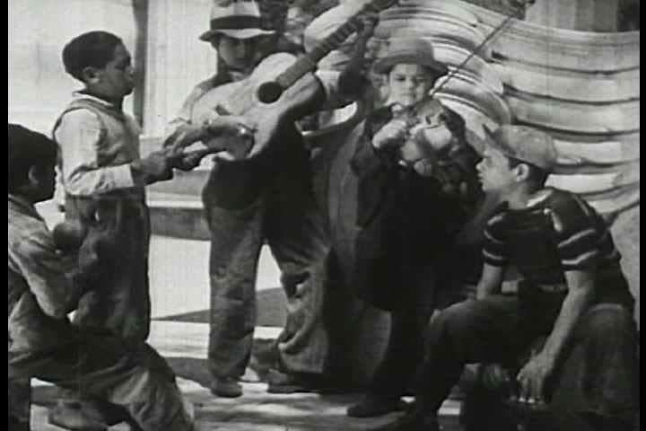 1940s - Montage of all aspects of life in Mexico city starting at morning and moving into lunchtime