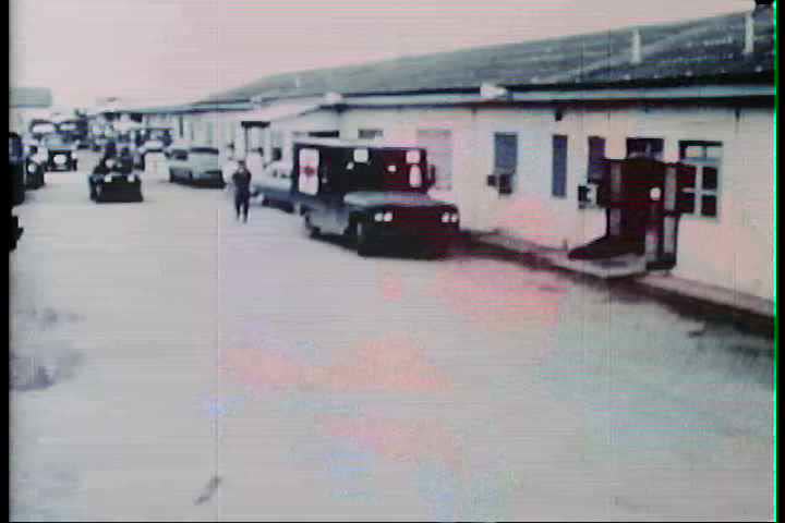 1960s - A soldier is brought to a military base for treatment during the Vietnam War.