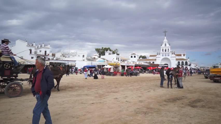 El ROCIO, ANDALUCIA, SPAIN - MAY 19: Pilgrims, people attend to the Sanctuario de Nuestra Senora de El Rocio in one of the most famous religious pilgrimage of Spain. May 19, 2013 in el Rocio, Spain