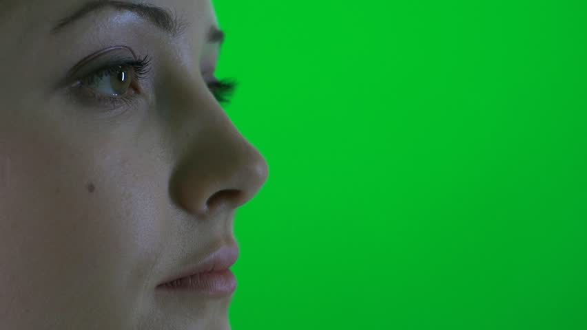 close up of women face isolated against green screen