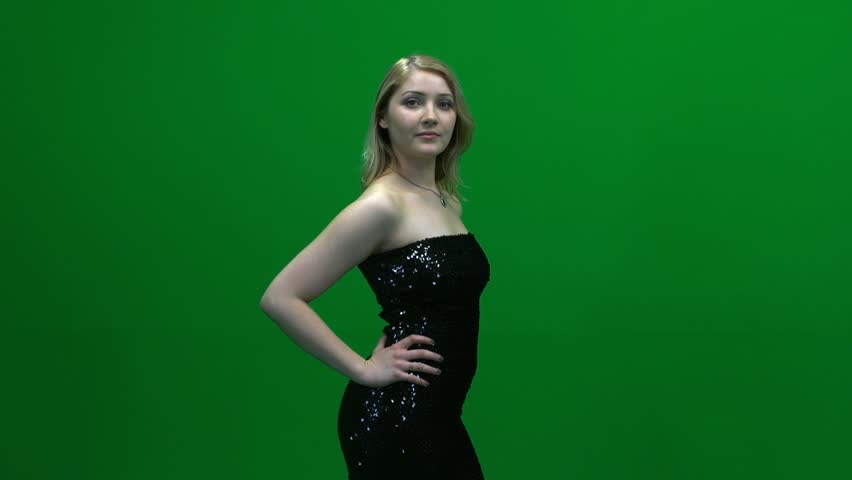 women in elegant dress against green screen