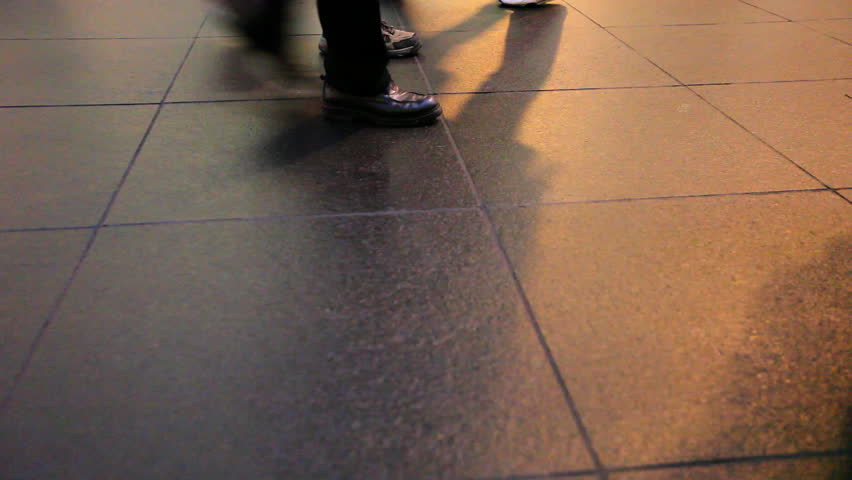 Passing feets of Pedastrians walking over shiny tile / HD1080 / 29.97fps 