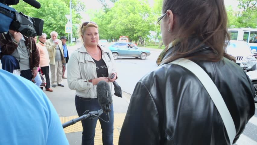 MOSCOW - JUN 4: Interview of eyewitness near serious car accident at intersection of Pogonny passage and 1-st Podbelsky passage, Jun 4, 2012, Moscow, Russia. Both drivers suffered.