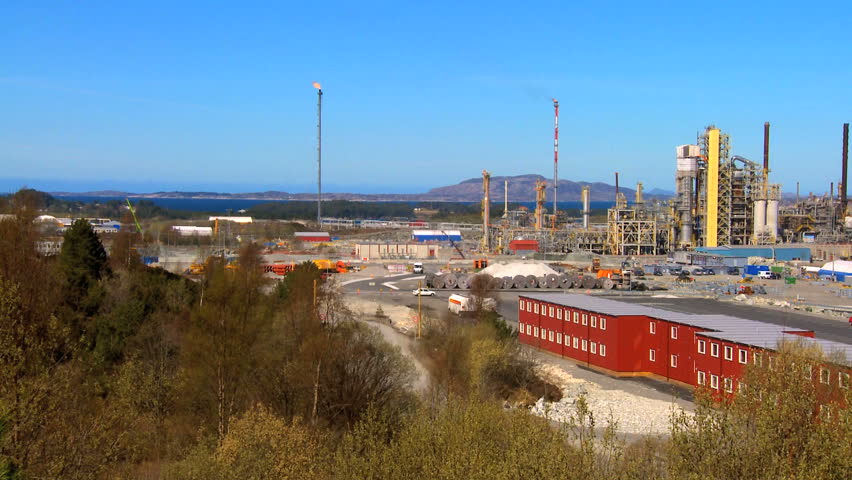 Oil refinery processing North Sea oil beside a nordic fjord
