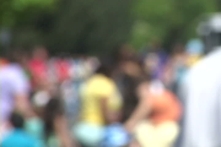 Background of many people gathered together with soft focus, unrecognizable people.