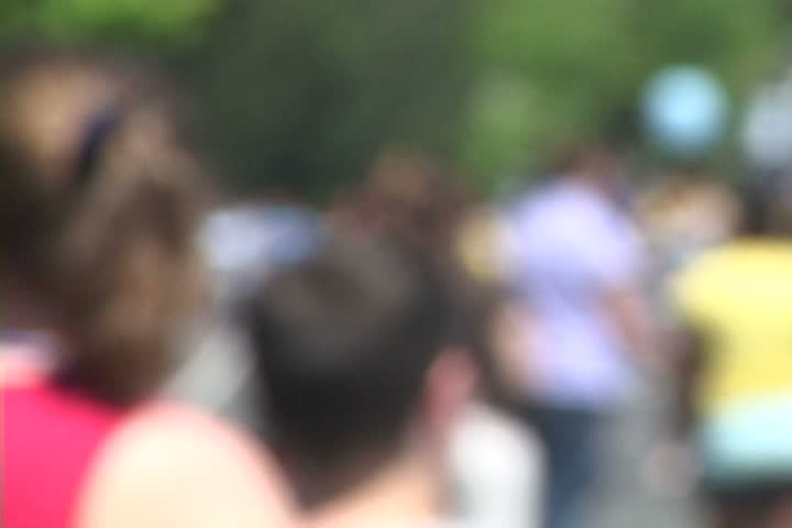 Background of many people gathered together with soft focus, unrecognizable people.