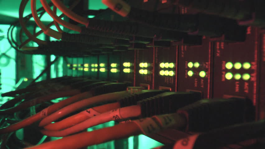 Fiber optic and ethernet cables connected into media converters