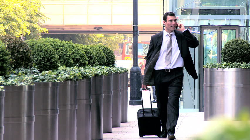 Young city businessman preparing to travel from city airport