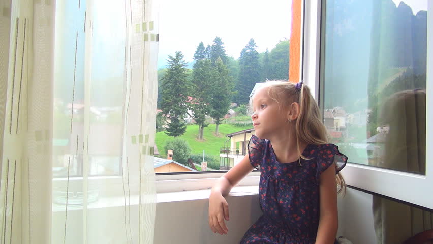 Unhappy Sad Caucasian Child Looking Out The Window Glass Thinking