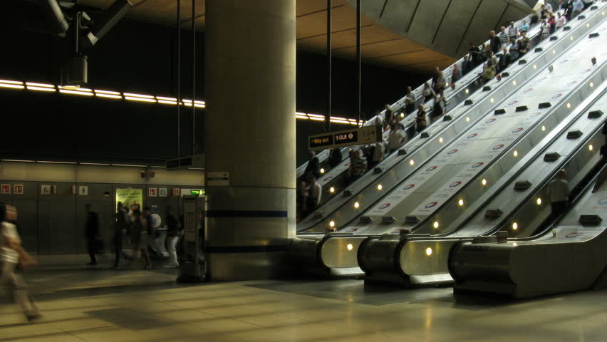 Time lapse of people using escalators at Canary Wharf underground station in London's Docklands HD 1920x1080 25fps