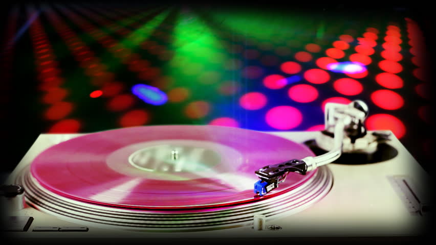dj record turntable with blurred disco scene in background