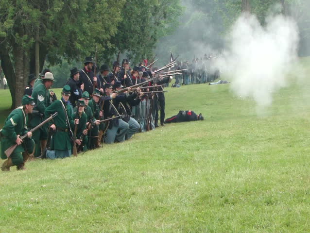 PORT GAMBLE, WA - JUN 20 - Civil War reenactors participate in a mock battle at Port Gamble WA on Jun 20, 2009.	Union infantry line fires volleys at the enemy 