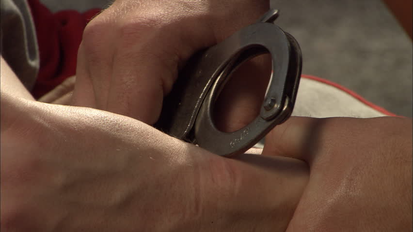 Criminal detention, close of an criminal's hands being handcuffed