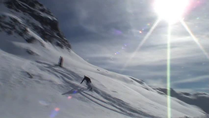 Snowboarder going over kicker