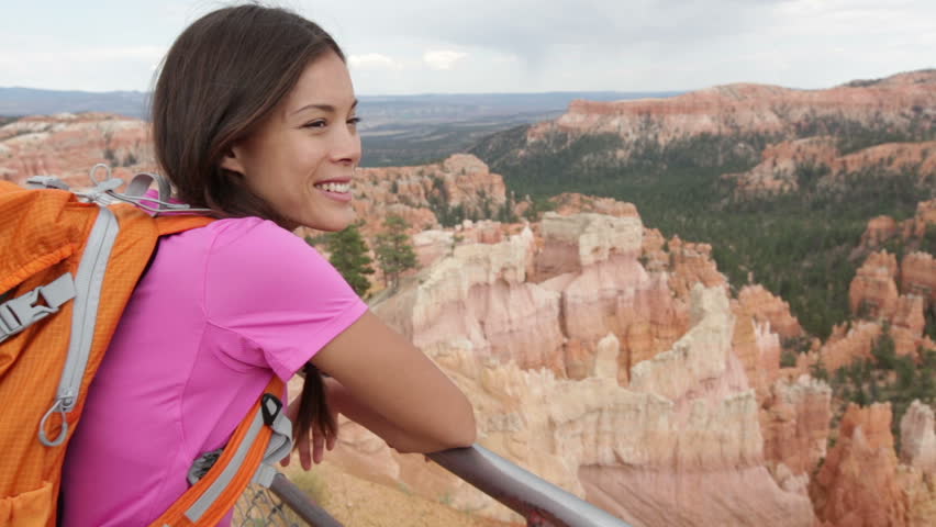 Hiker Woman In Bryce Canyon Hiking Looking And Enjoying View During Her Hike Wearing Hikers