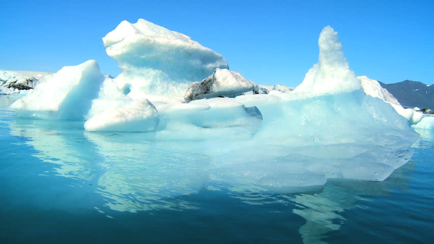 Glacial ice slowly melting into the lake through global warming 60 FPS