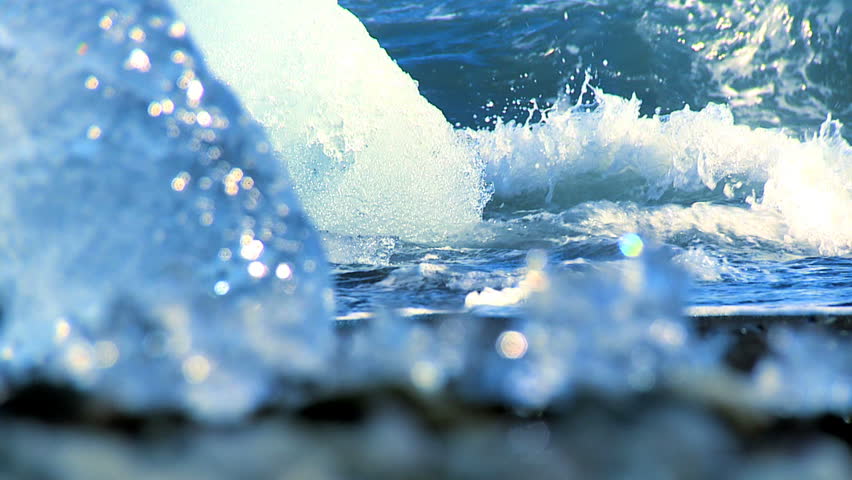 Melting glacial ice from climate change washed up on an arctic beach 60 FPS