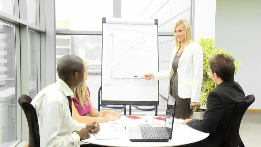 Businesswoman giving a presentation to her team 