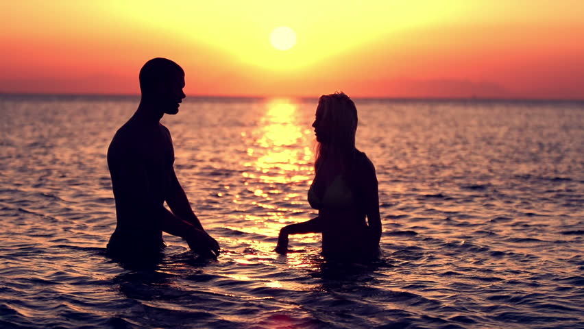 Couple On The Shore Of The Sea Romantic Couple At Sunset Two People