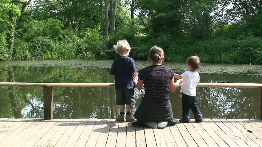 Mum and kids by lake