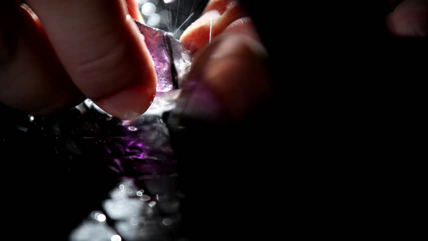 Hand cut gem - macro with water drops and sparkles