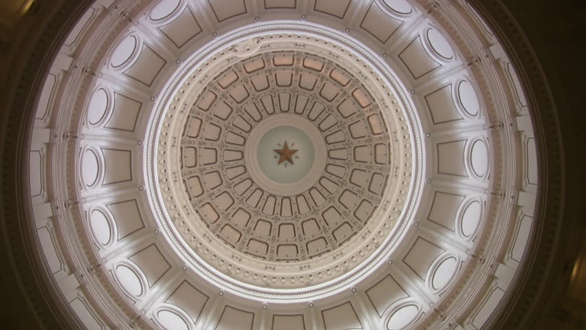 Video of State capital of Texas. Austin Texas. Inside of government complex showing the historic designs. Rotunda dome with extensive decorations and numerous floor rails. Rotunda dome star zoom in.