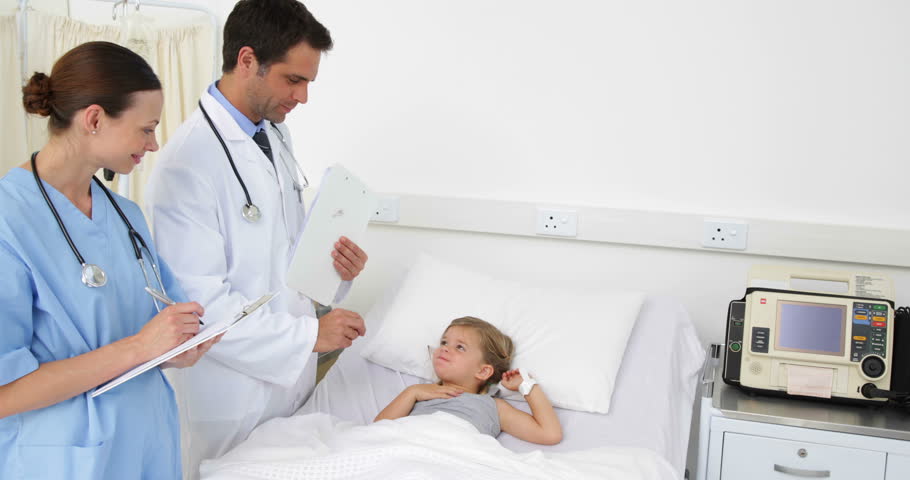 Doctor Showing Patient In Bed An Xray In The Hospital Ward Stock Footage Video 5899934