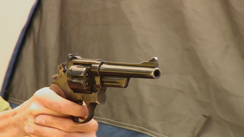 young man fires three shots from .357 magnum Smith & Wesson revolver