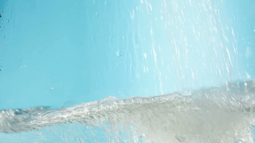 water flowing and making bubbles filling all frame 