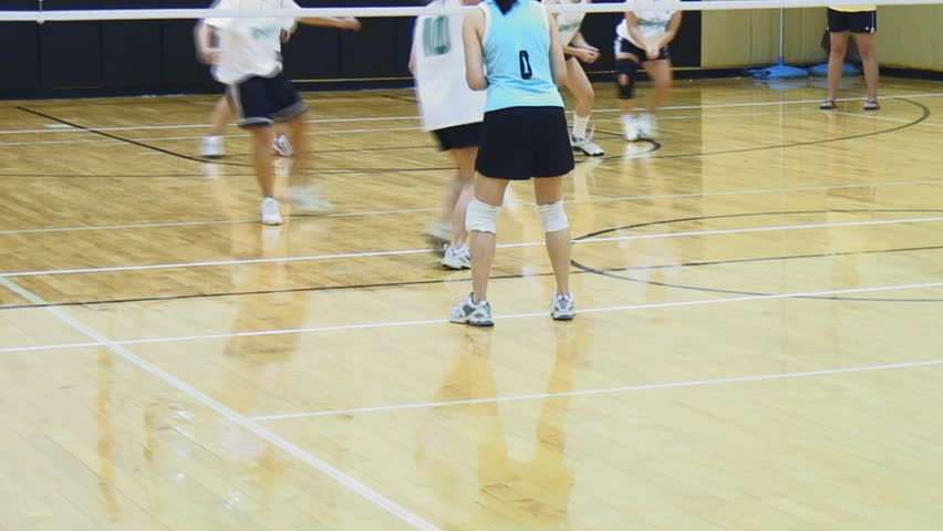 women volleyball athletes play on shiny wood court, with audio