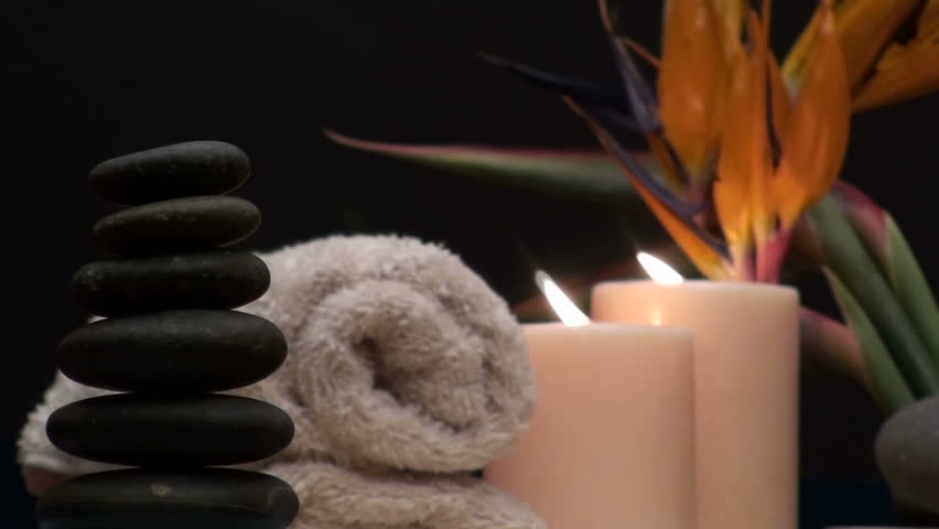 Zen Spa setting with massage rocks and birds of paradise