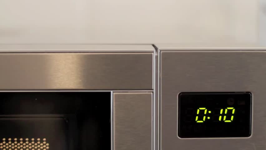 Microwave timer counting down from ten.