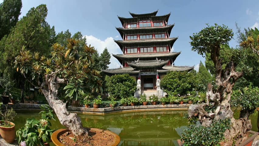 Lijiang, China - August 20: Chinese and world travelers enjoy visiting old town Lijiang including old architecture, restaurants and the local pagoda in Yunnan province, August 20, 2009