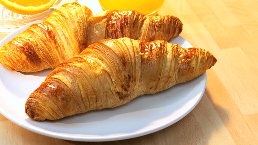 Croissants & fresh orange juice full of vitamins making breakfast an important part of a busy lifestyle