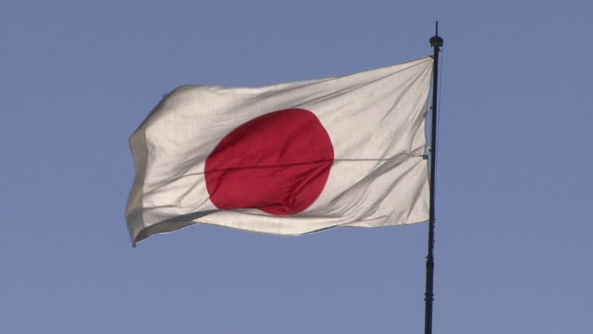 TOKYO - JANUARY 17: The Japanese national flag waves in the wind. Seen in Ginza, Tokyo. January 17, 2010